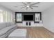 Living room with recessed lighting, ceiling fan, and a large entertainment center at 3813 W Lapenna Dr, New River, AZ 85087