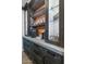 Custom wet bar featuring dark wood cabinetry, a beverage cooler, and a coffee station at 3813 W Lapenna Dr, New River, AZ 85087