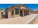 Back exterior view of a home with a covered patio and large concrete patio at 385 E Ironwood Dr, Chandler, AZ 85225
