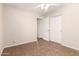 Empty bedroom featuring a ceiling fan, and double sliding-door closet at 385 E Ironwood Dr, Chandler, AZ 85225