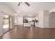 Open floorplan with an island and access to a bright kitchen equipped with stainless steel appliances at 385 E Ironwood Dr, Chandler, AZ 85225