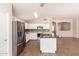 Modern kitchen featuring white cabinets, stainless steel appliances, and a center island at 385 E Ironwood Dr, Chandler, AZ 85225