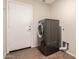 Laundry room with front-load washer and dryer, and neutral-colored walls at 385 E Ironwood Dr, Chandler, AZ 85225