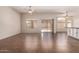 Spacious living room showcasing tile floors, ceiling fans, and sliding door access to the patio at 385 E Ironwood Dr, Chandler, AZ 85225
