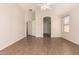 Spacious main bedroom featuring tiled floors, neutral walls, and access to ensuite at 385 E Ironwood Dr, Chandler, AZ 85225
