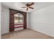 Bedroom with brick accent, ceiling fan and a window offering lots of natural light at 3929 W Goldmine Mountain Dr, San Tan Valley, AZ 85144