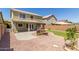 Backyard featuring a covered patio and pergola with seating, perfect for relaxing at 3929 W Goldmine Mountain Dr, San Tan Valley, AZ 85144