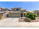 Two-story home with a two car garage, tile roof, and landscaped front yard at 3929 W Goldmine Mountain Dr, San Tan Valley, AZ 85144