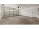 Spacious garage with concrete floors, an automatic door, and ample room for storage at 3929 W Goldmine Mountain Dr, San Tan Valley, AZ 85144