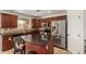 Well-equipped kitchen featuring stainless steel appliances, granite countertops, and a central island with seating at 3929 W Goldmine Mountain Dr, San Tan Valley, AZ 85144