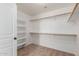 Spacious walk-in closet with built-in shelving and ample hanging space for organized storage at 3929 W Goldmine Mountain Dr, San Tan Valley, AZ 85144