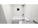 Modern bathroom featuring granite vanity, black hardware and a tiled shower at 4219 W Citrus Way, Phoenix, AZ 85019