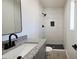 Modern bathroom with granite vanity top, black fixtures and custom tiled shower at 4219 W Citrus Way, Phoenix, AZ 85019