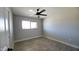 Bright bedroom features a ceiling fan and a window that provides natural light at 4219 W Citrus Way, Phoenix, AZ 85019