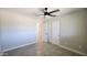 Spacious bedroom with tile floors and closet with sliding doors for storage at 4219 W Citrus Way, Phoenix, AZ 85019