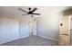Cozy bedroom leading to the tiled bathroom with sliding door closet for storage at 4219 W Citrus Way, Phoenix, AZ 85019