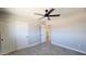 Bedroom with tile floors featuring a closet with doors that slide and ceiling fan at 4219 W Citrus Way, Phoenix, AZ 85019