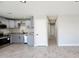 Modern kitchen with grey cabinets, stainless steel appliances, and granite countertops at 4219 W Citrus Way, Phoenix, AZ 85019
