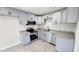 Updated kitchen featuring stainless steel appliances, granite countertops, and modern cabinetry at 4219 W Citrus Way, Phoenix, AZ 85019
