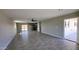 An open-concept living space with tile flooring, recessed lighting and view of the kitchen at 4219 W Citrus Way, Phoenix, AZ 85019
