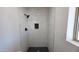 A tiled shower room with decorative tiles and dark fixtures at 4219 W Citrus Way, Phoenix, AZ 85019