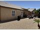 Expansive backyard featuring a patio area, desert landscaping, and a charming outdoor dining setup at 4322 E Cottonwood Ln, Phoenix, AZ 85048