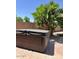 Hot tub in a well-maintained backyard featuring desert landscaping and privacy fencing at 4322 E Cottonwood Ln, Phoenix, AZ 85048