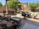 Private backyard with a hot tub, outdoor furniture, and a lush landscaped area at 4322 E Cottonwood Ln, Phoenix, AZ 85048