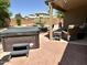 Backyard patio featuring a covered hot tub and comfortable seating at 4322 E Cottonwood Ln, Phoenix, AZ 85048