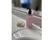 Bathroom detail showing elegant hand soap and stylish soap dish on a bright, clean countertop at 4322 E Cottonwood Ln, Phoenix, AZ 85048
