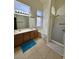 Bright bathroom with double vanity, soaking tub, and separate glass-enclosed shower at 4322 E Cottonwood Ln, Phoenix, AZ 85048