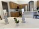 Dining table features small plants and modern candle holders at 4322 E Cottonwood Ln, Phoenix, AZ 85048