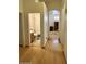 Hallway view of the bathroom with a shower, toilet, and vanity at 4322 E Cottonwood Ln, Phoenix, AZ 85048