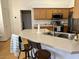 Kitchen view with island, stainless appliances, and natural wood cabinets at 4322 E Cottonwood Ln, Phoenix, AZ 85048