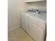 Functional laundry room with a white washer and dryer at 4322 E Cottonwood Ln, Phoenix, AZ 85048