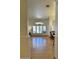 Bright, airy living room with wood floors, archways and large windows that flood the space with natural light at 4322 E Cottonwood Ln, Phoenix, AZ 85048
