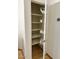 Pantry with shelving and sliding wire baskets on the door at 4322 E Cottonwood Ln, Phoenix, AZ 85048