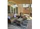 Inviting covered patio with comfortable seating, a coffee table, and an area rug, perfect for outdoor living at 4322 E Cottonwood Ln, Phoenix, AZ 85048