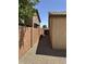 View of the side yard with desert landscaping and a brick wall at 4322 E Cottonwood Ln, Phoenix, AZ 85048