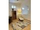Cozy sitting area features a modern chair, a rug, and is complemented by natural light from windows at 4322 E Cottonwood Ln, Phoenix, AZ 85048