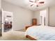 View of bedroom featuring a ceiling fan, plush carpet, and doorway to living area at 4565 N Point Ridge Rd, Buckeye, AZ 85396