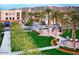 Beautiful landscaped community area with walking paths, palm trees and nearby shops and restaurants at 4565 N Point Ridge Rd, Buckeye, AZ 85396