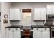 Kitchen features a desk area with built-in cabinetry, perfect for a home office or study space at 4565 N Point Ridge Rd, Buckeye, AZ 85396