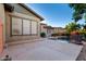 Backyard pool area showcasing home's exterior and expansive pool area with rock waterfall at 4565 N Point Ridge Rd, Buckeye, AZ 85396