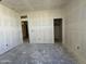 A well-lit room features multiple doorways, providing flexibility and easy access to other areas of the house at 47214 W Cansados Rd, Maricopa, AZ 85139