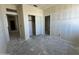A bedroom under construction features a closet and multiple doorways, offering flexibility for different layouts at 47214 W Cansados Rd, Maricopa, AZ 85139