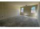 This bedroom with two windows offers natural light and space for your personalized design at 47214 W Cansados Rd, Maricopa, AZ 85139