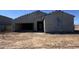 A single-story house featuring an attached garage and a neutral-toned stucco exterior awaits landscaping at 47214 W Cansados Rd, Maricopa, AZ 85139