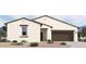 Beautiful single-story home with a well-maintained landscape and a two-car garage at 47214 W Cansados Rd, Maricopa, AZ 85139