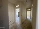 A bright hallway with multiple doorways showcases the layout of the home under construction at 47214 W Cansados Rd, Maricopa, AZ 85139